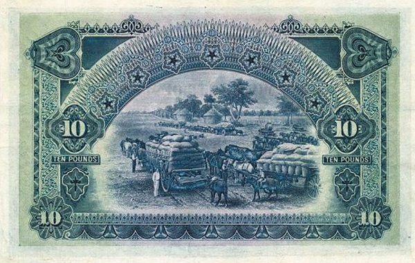 Horse wagons loaded  with sacks of grain