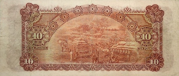 Horse wagons loaded  with sacks of grain