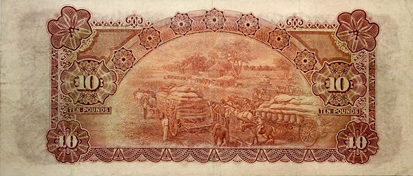 Horse wagons loaded  with sacks of grain