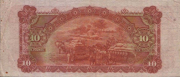Horse wagons loaded  with sacks of grain