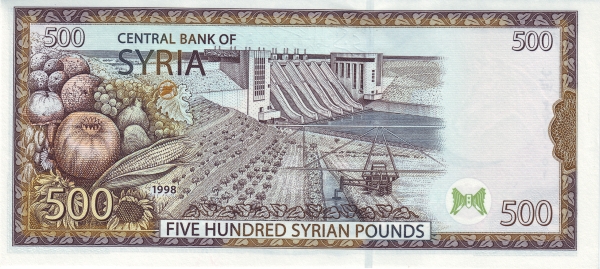 Tabqa dam on Euphrat  River,  tractor irrigating trees