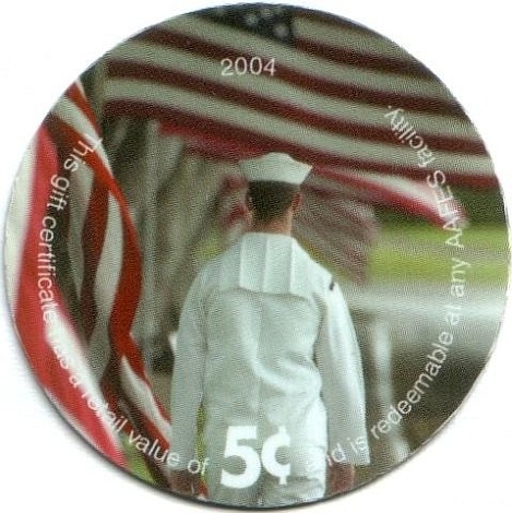 Sailor walking away  toward row of flags