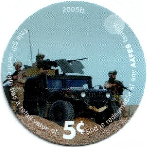 Soldiers with guns  beside humvee