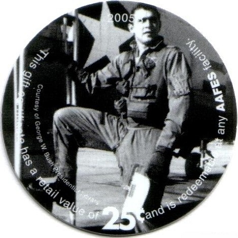 George H. W. Bush  standing in front WWII era plane