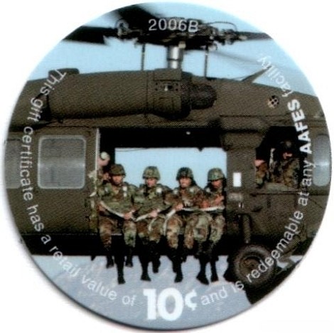 Soldiers sitting in  helicopter doorway