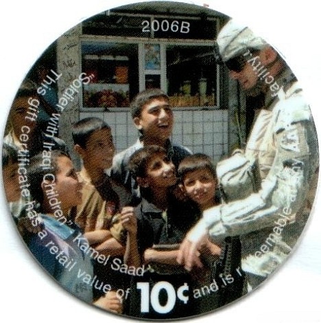 "Soldier with  Iraqi Children" (photo by Kamel Saad)