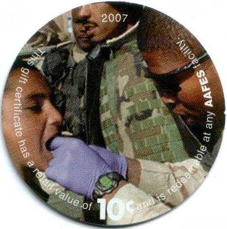 Soldier looking into a  boy's mouth
