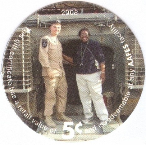Soldiers standing on  rear door of Stryker vehicle