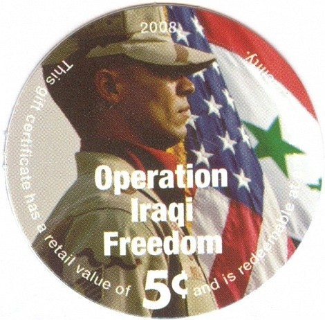 Soldier in front of  U.S. and Iraqi Flag