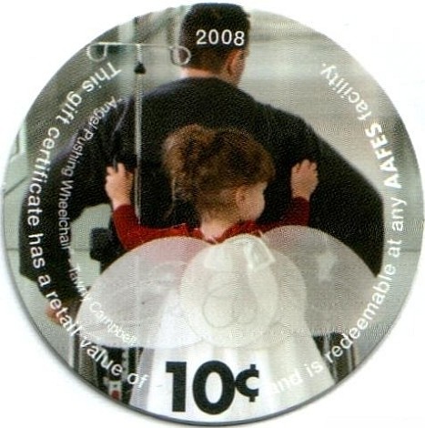 Child with angel wings  pushing a wheelchair (photo by Tawny Campbell)
