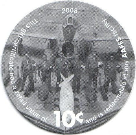 Airmen standing with  bombs in front of an aircraft