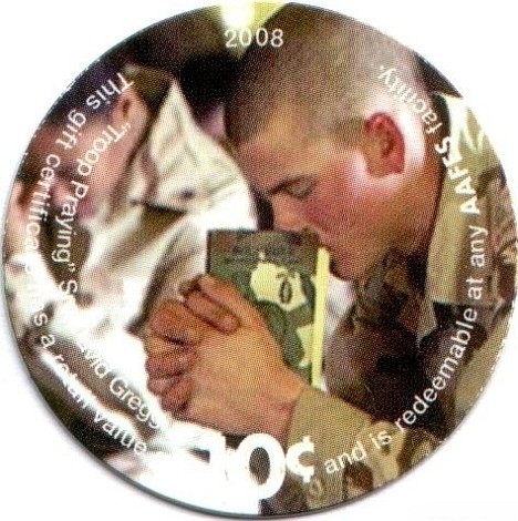 Soldier praying with a  Bible (photo by Sr. Airman David Gregg)